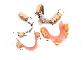 Closeup of partial dentures in Grand Prairie on white background