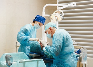 Oral surgeons placing dental implants in Grand Prairie, TX