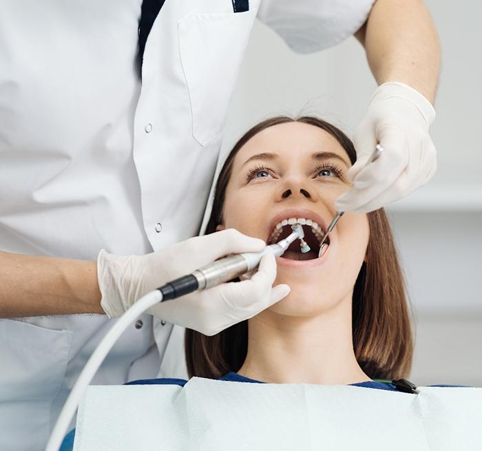 Patient preparing for a dental checkup and cleaning in Grand Prairie