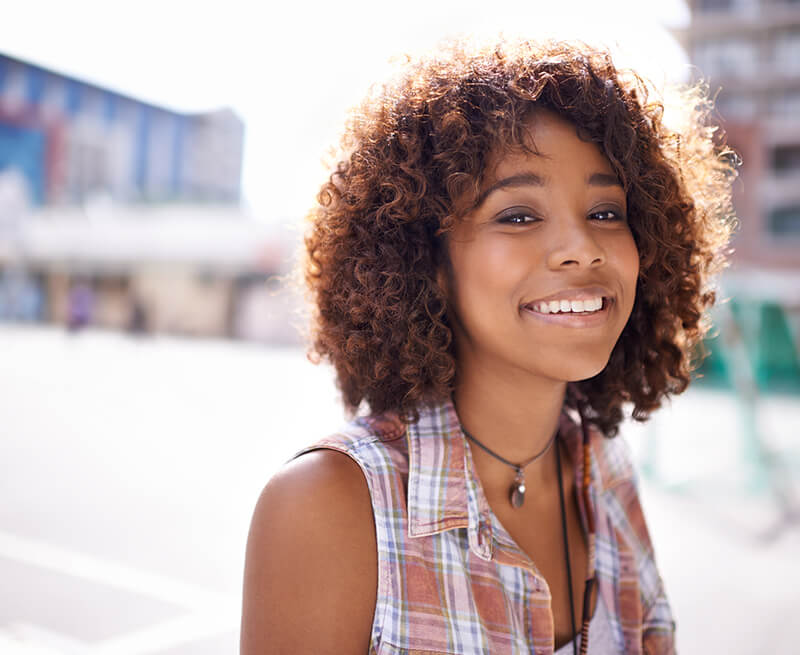 Woman with perfect smile after cosmetic dentistry