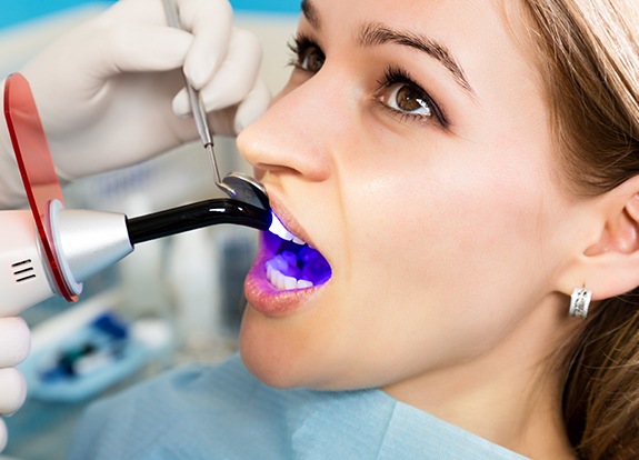 Patient receiving dental bonding treatment