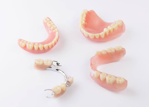 Different types of dentures in Grand Prairie on white background