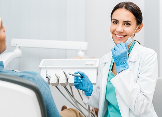 Emergency dentist in Grand Prairie smiling with patient