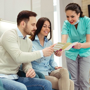 dentist explaining financing options to patient