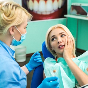 Grand Prairie dentist visiting with pain dental patient