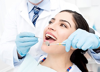 Closeup of woman smiling during dental checkup