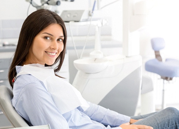 Happy female patient visiting dentist on a Saturday