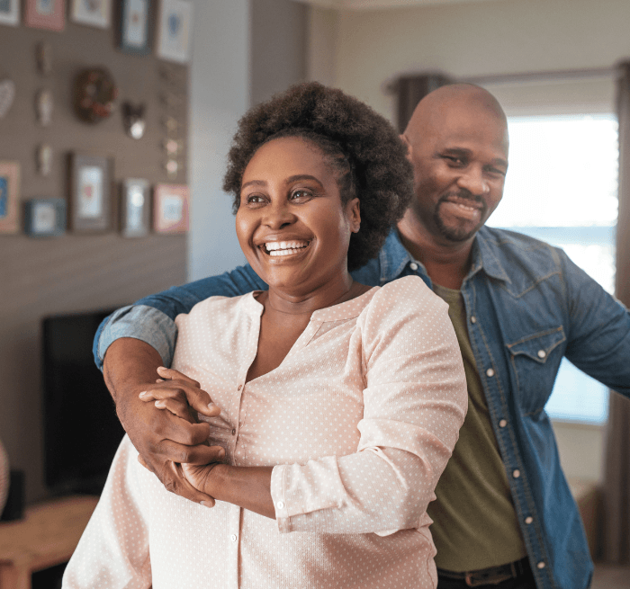 Man and woman with healthy smiles after dental services