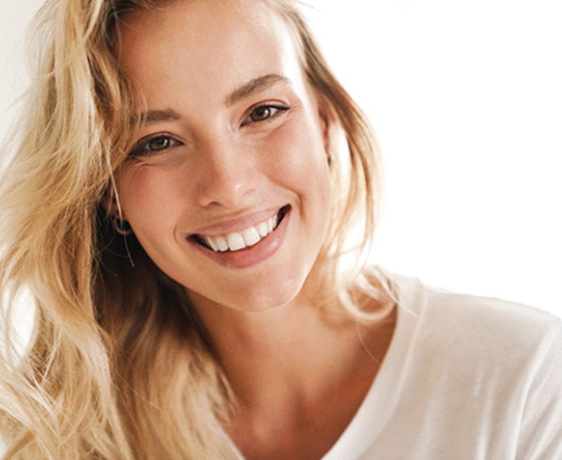 Closeup of woman smiling with straight, white, healthy teeth