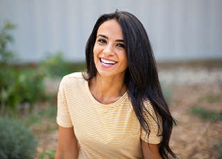 Young woman with a striped shirt smiling