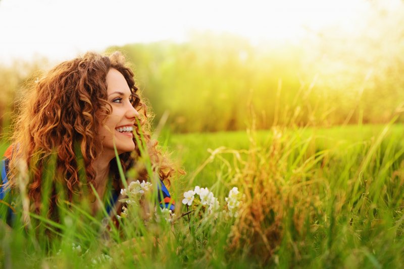 Woman smiling in grass