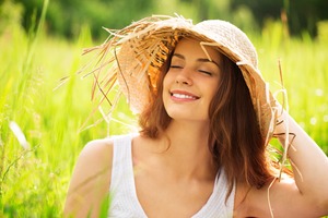 Woman with beautiful smile enjoying the summer sun