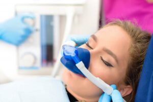 Woman getting laughing gas for her dental visit