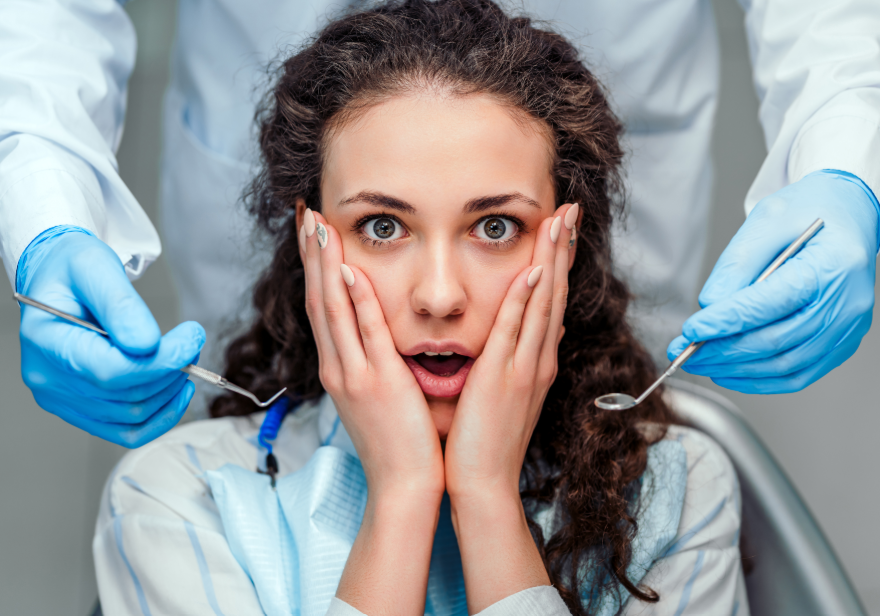 Patient looking scared in dentist's chair